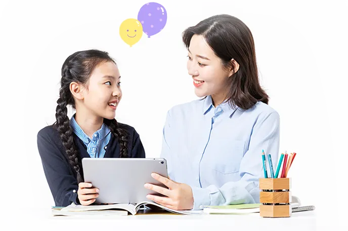 윤선생 영어교실 선생님과 학생이 태블릿으로 함께 학습하는 모습